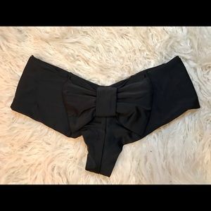 Super low rise swim bottom with bow worn one time